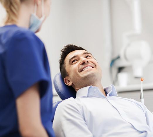 Patient smiling at orthodontist during consultation