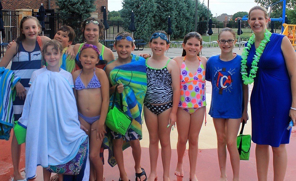 Doctor Jones with children at pool party event