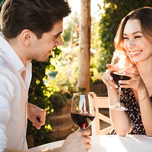 Couple smiling on date at winery