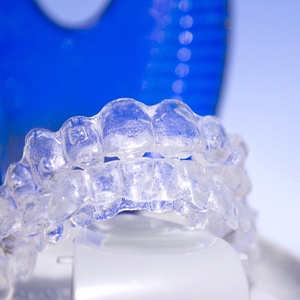 An up-close view of a set of clear aligners sitting inside a protective case in Plano