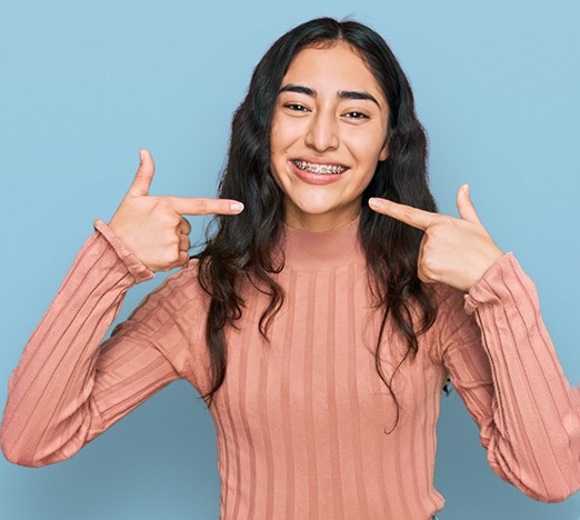 Teen girl wearing braces as part of phase 2 orthodontics in Plano