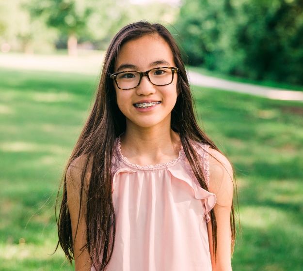 Smiling patient with traditional braces