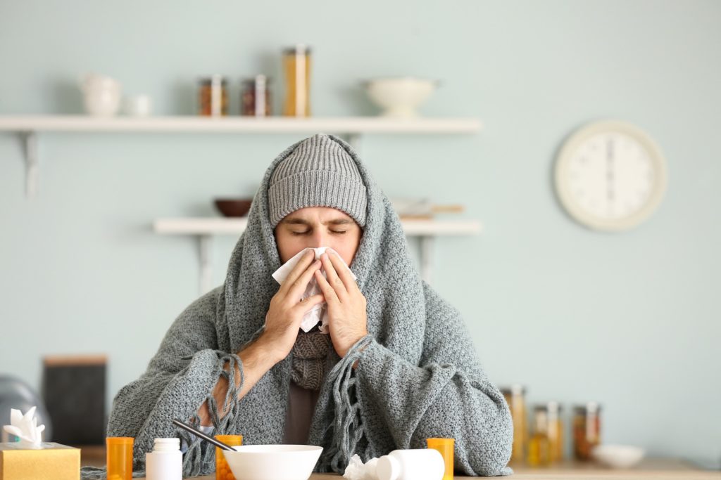 Patient blowing his nose while eating soup