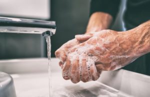 Man washing hands during cold and flu season