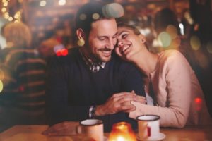 a couple smiling and on a date