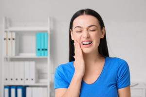 a closeup of a patient with metal braces 